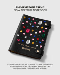 Black STICKYZOO leather notebook finished with colorful raised gem details and gold lettering