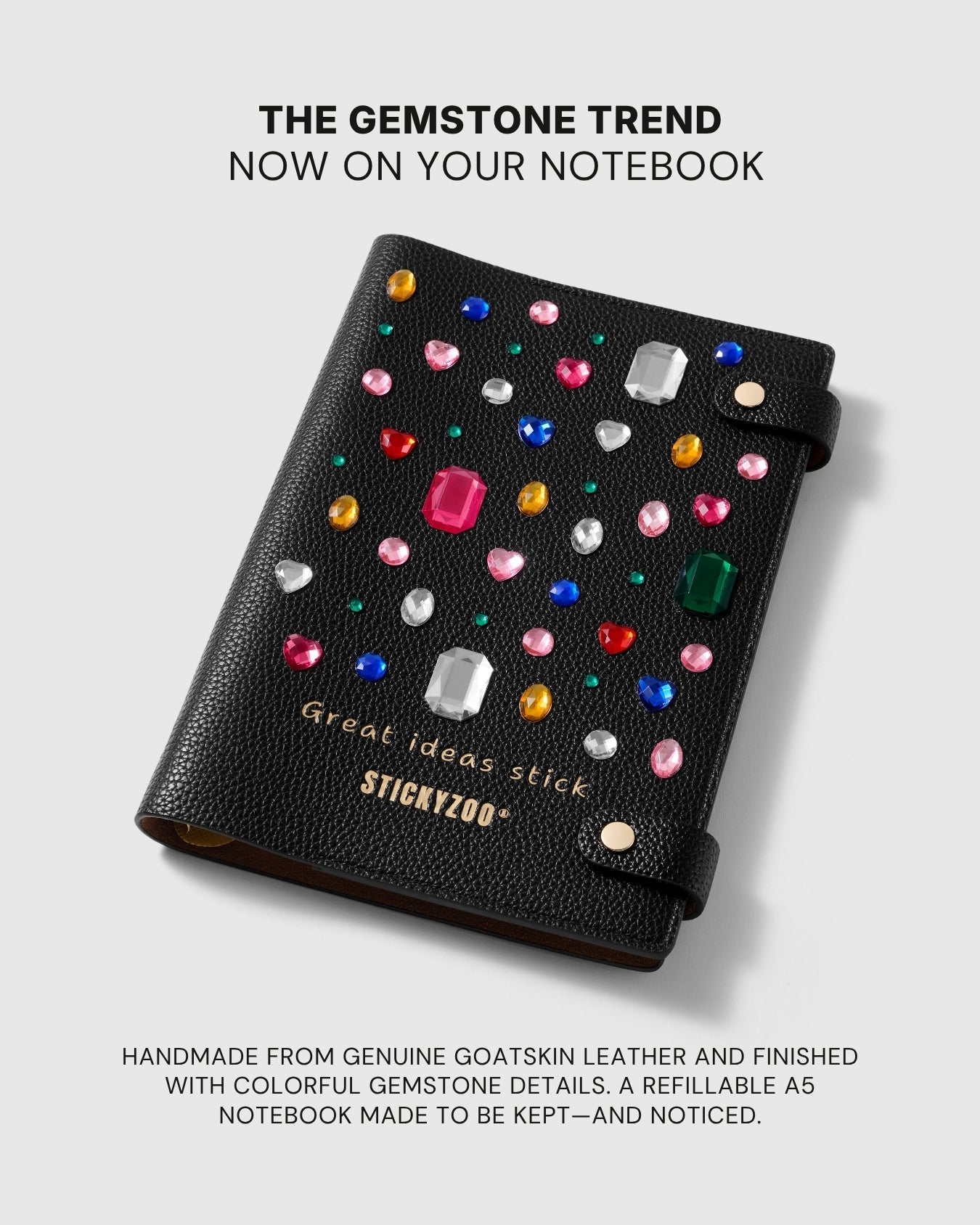 Black STICKYZOO leather notebook finished with colorful raised gem details and gold lettering