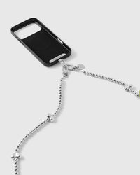 Black phone case connected to the silver-tone ball-bead strap with puffy hearts running down the chain.