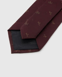 STICKYZOO Burgundy Glyph Tie reverse showing structured interlining and hand-finished slip stitching, 145 × 8 cm.