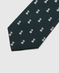 Forest Tiger Cub Tie detail showing forest ground with ivory tiger cubs and amber accents and the tactile silk surface.