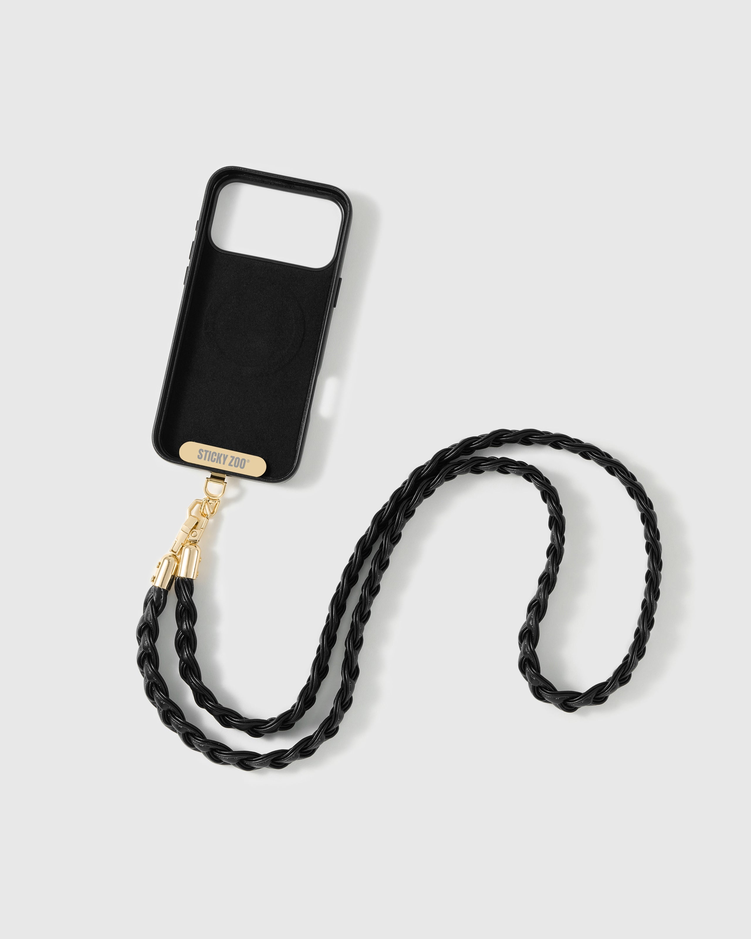 STICKYZOO noir woven phone strap attached to a phone case through the included Phone Strap Card