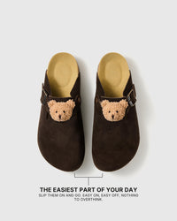 Pair of teddy bear suede clogs showing the open heel, closed toe, and easy slip-on shape