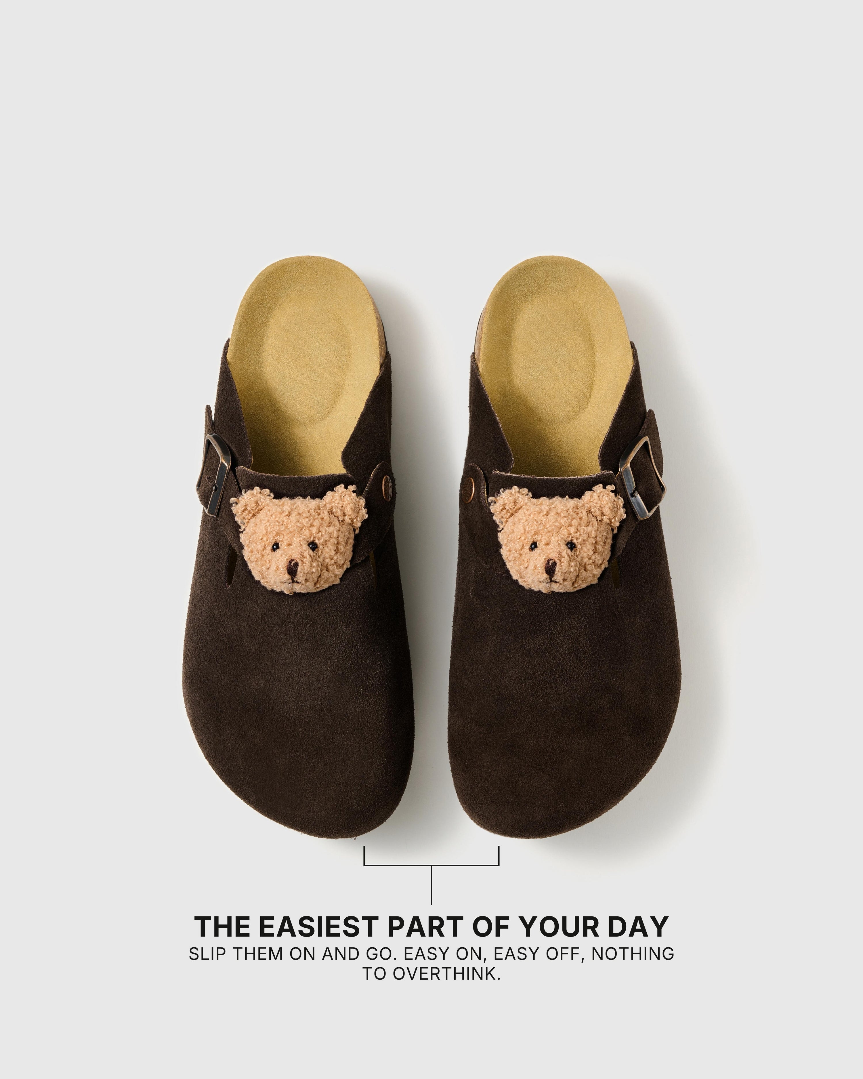 Pair of teddy bear suede clogs showing the open heel, closed toe, and easy slip-on shape