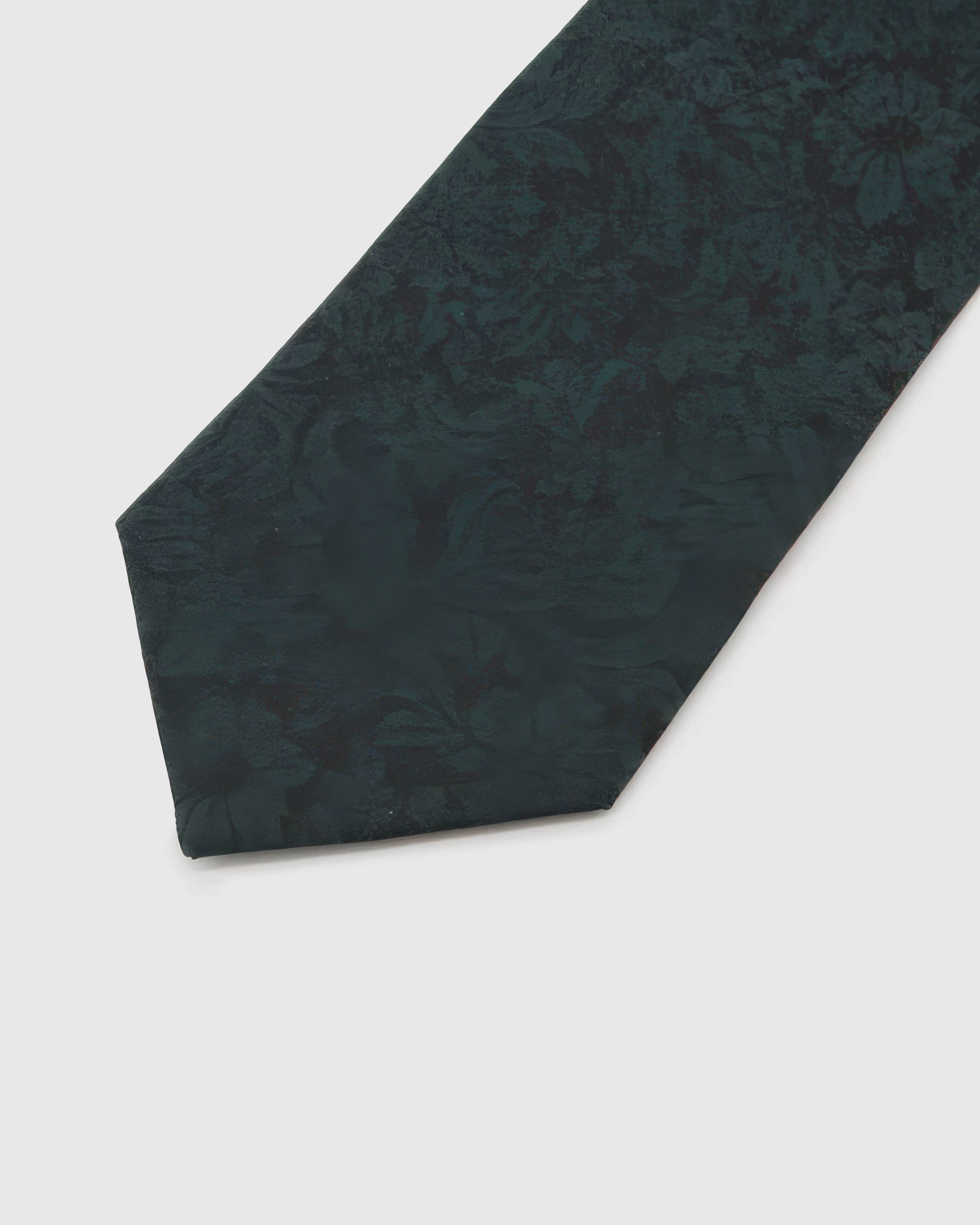 STICKYZOO Forest Shadow Floral Tie reverse showing structured interlining and hand-finished slip stitching, 145 × 8 cm.