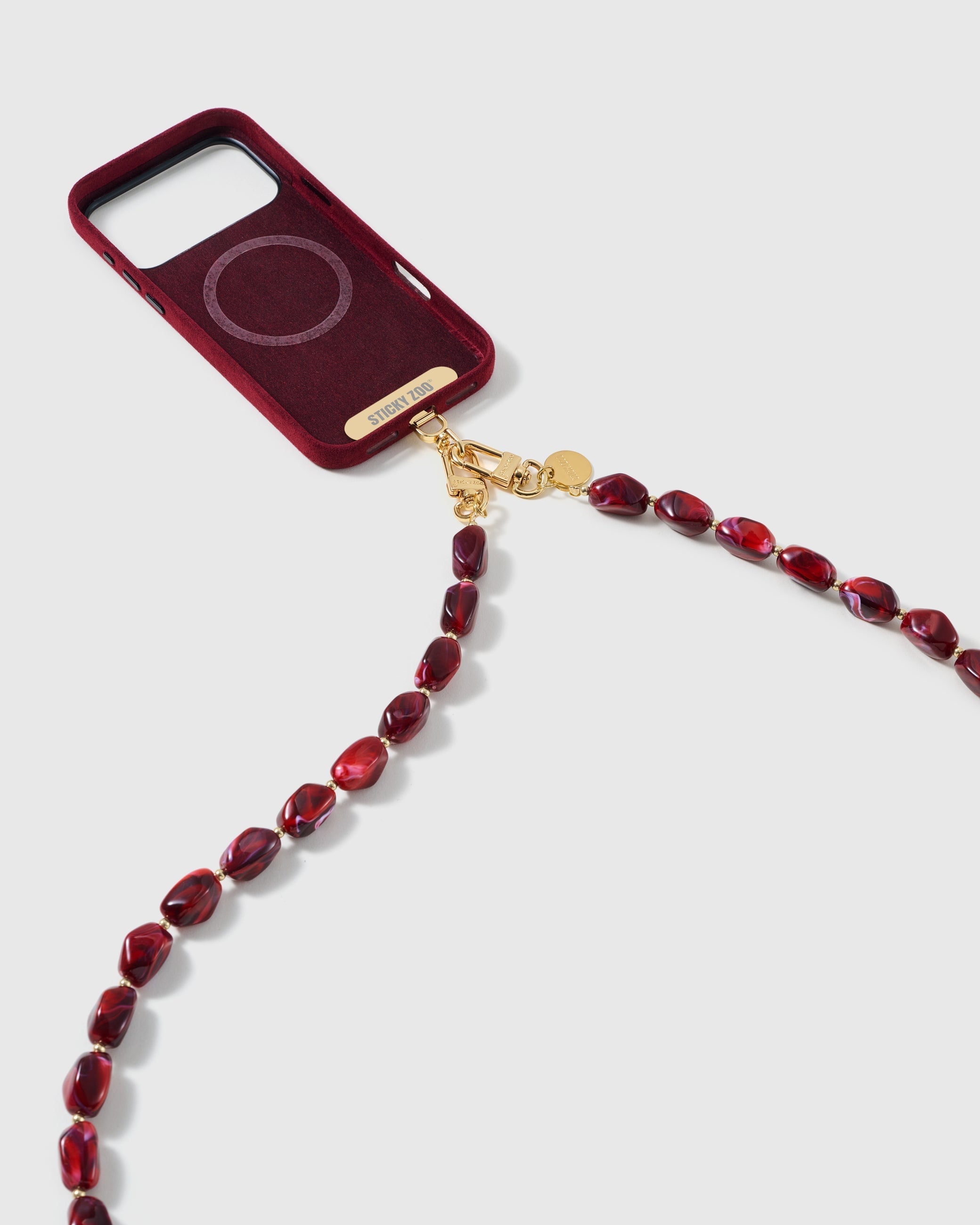 Dual-clasp beaded cross-body strap clipped to a phone case, showing universal fit via the included Phone Strap Card