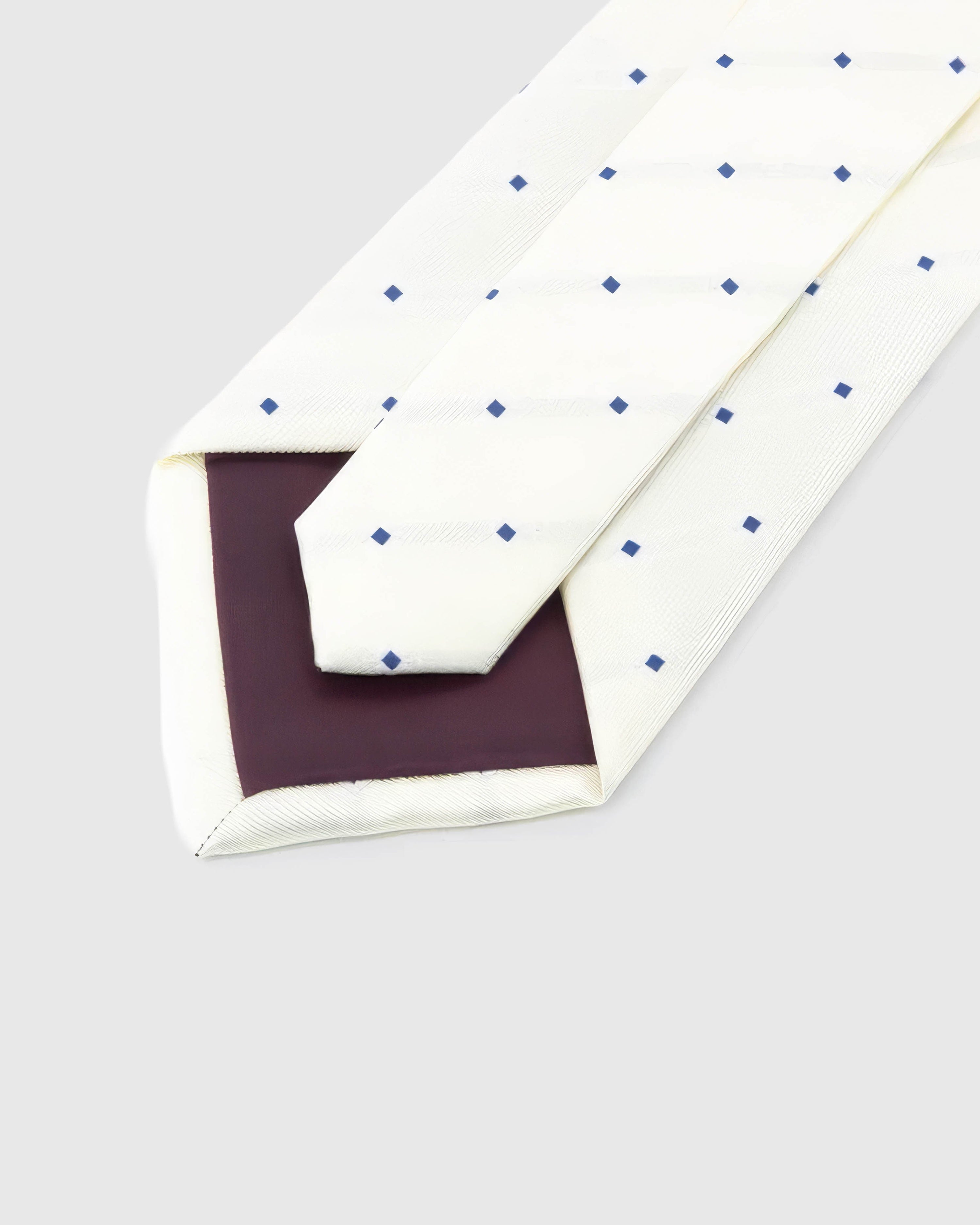 STICKYZOO Ivory Navy Square Tie reverse showing structured interlining and hand-finished construction, 145 × 8 cm.
