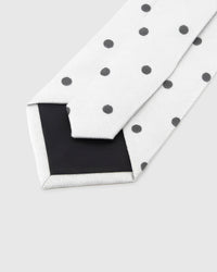 Back of STICKYZOO Pearl Onyx Dot Tie showing black structured interlining, hand-finished folds and keeper, 145 × 8 cm