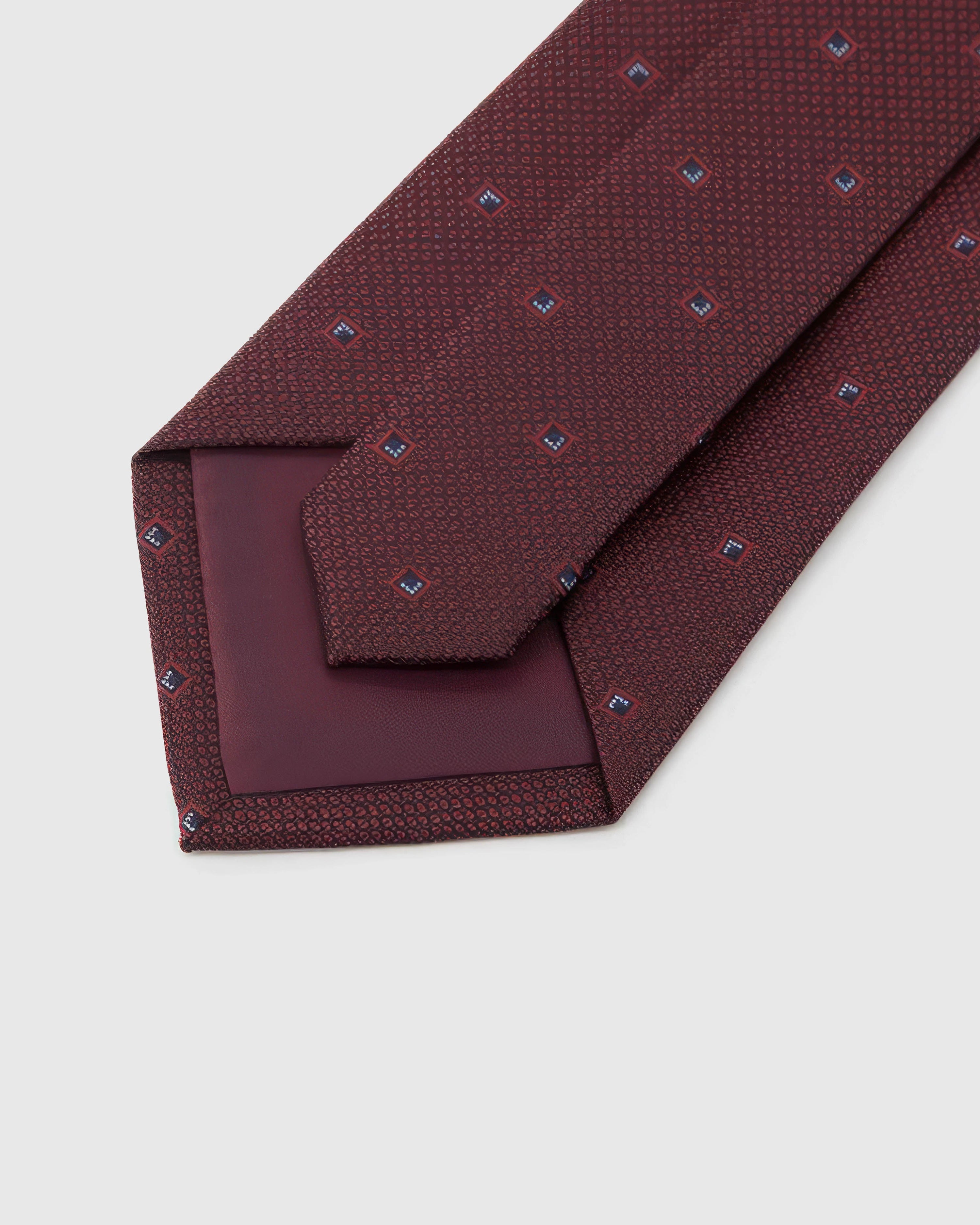 STICKYZOO Garnet Diamond Tie reverse showing structured interlining and hand-finished construction, 145 × 8 cm.