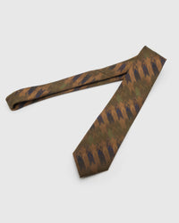 Amber Brushwork Tie laid full length to show amber and walnut brushwork with navy, olive, rust and tan from blade to tail.