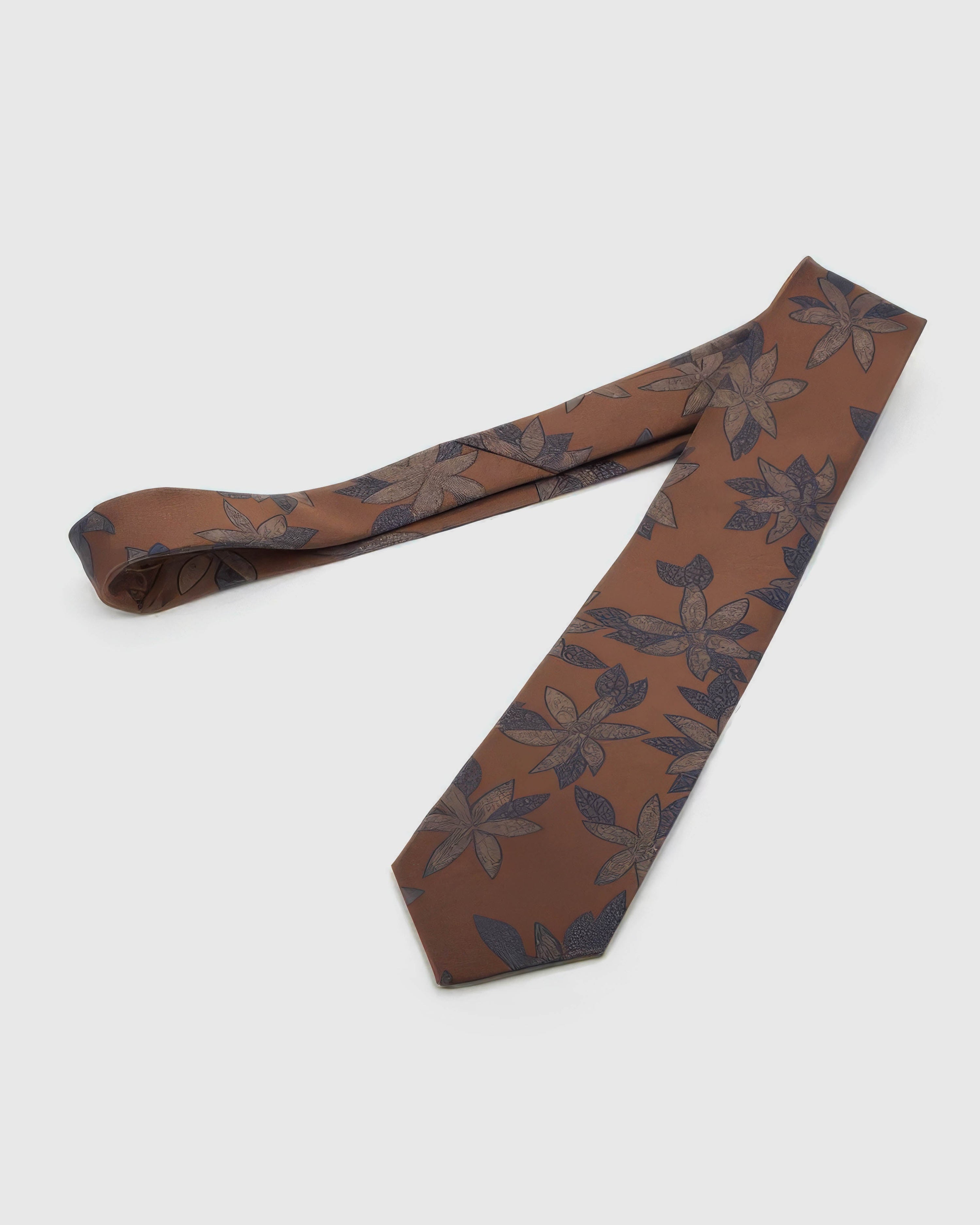 Full-length STICKYZOO Caramel Botanical Bloom Tie showing midnight botanical blooms across a 145 × 8 cm hand-finished mulberry silk tie