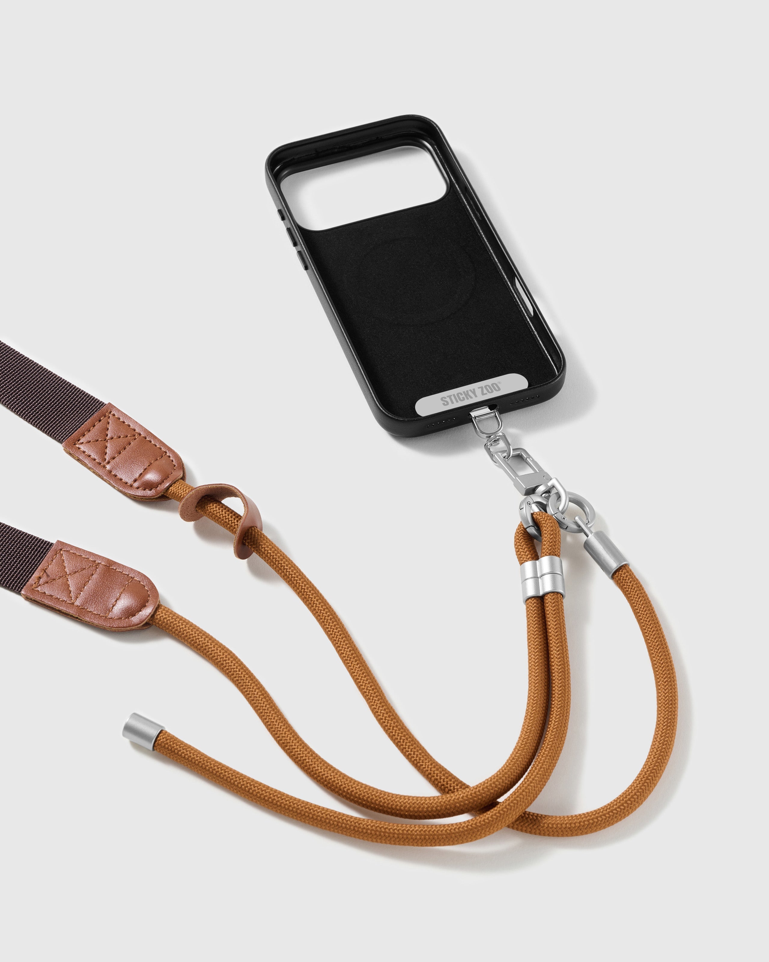 STICKYZOO amber adjustable strap attached through a Phone Strap Card with the sliding ring visible