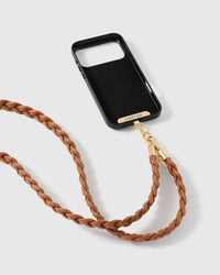 Cognac braided cross-body phone strap attached to a black phone case for hands-free everyday carry