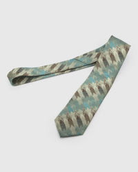 Sage Brushwork Tie laid full length to show sage, aqua, ivory and umber abstract brushwork from blade to tail.