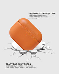 Orange AirPods case landing on a cracked surface to illustrate drop protection