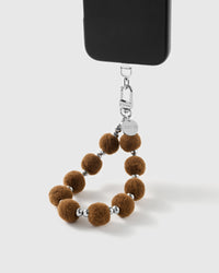 Handmade beaded phone strap on a black case, rated 4.9 across 5,000+ reviews
