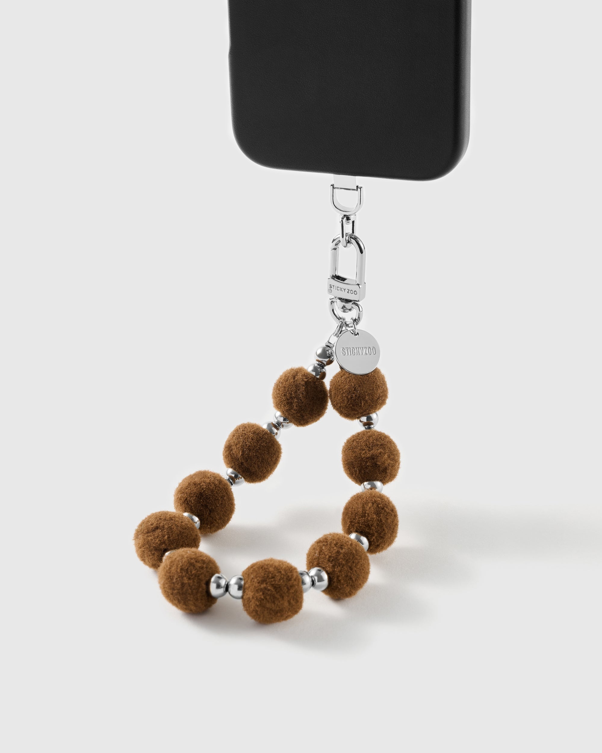 Handmade beaded phone strap on a black case, rated 4.9 across 5,000+ reviews