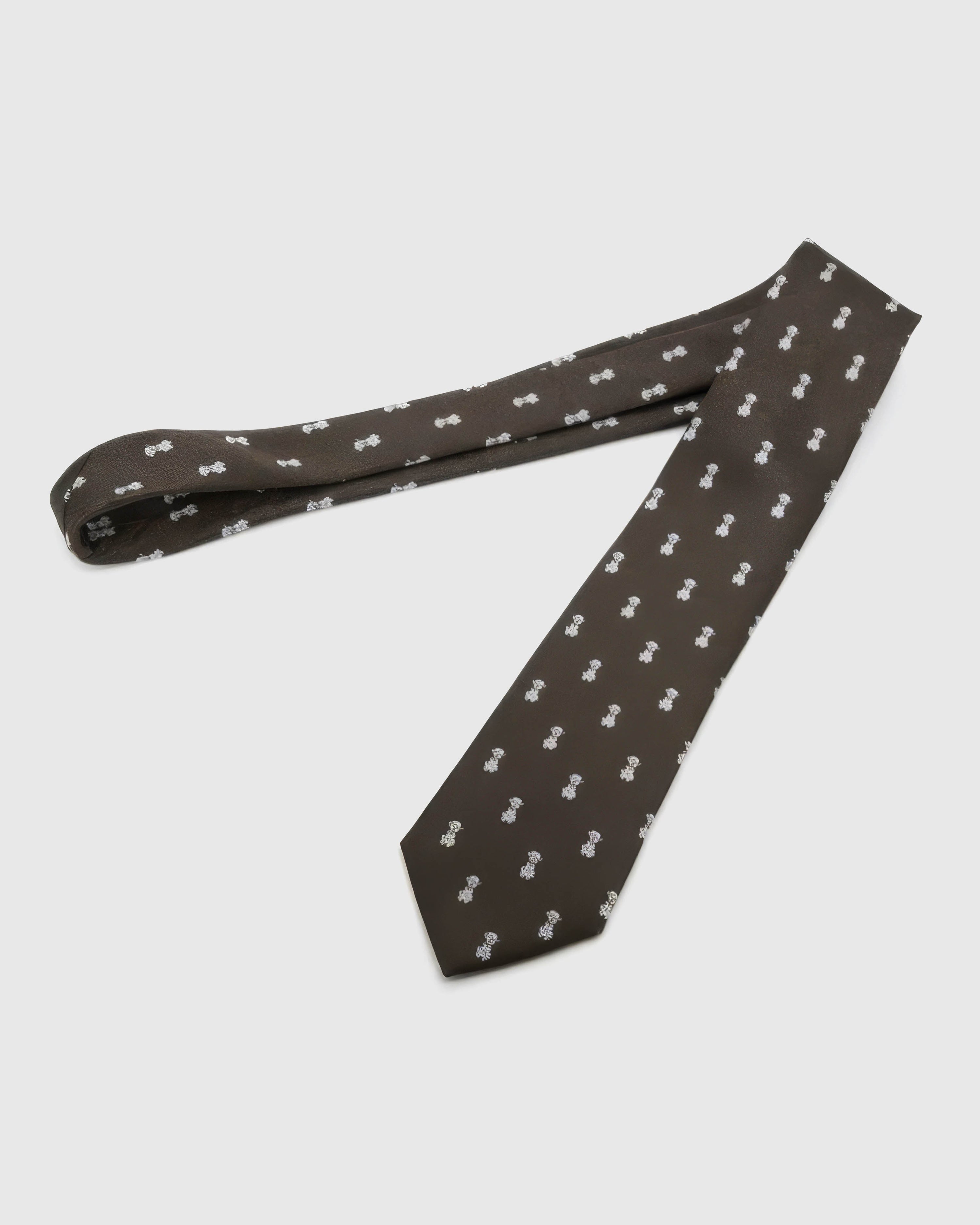 Espresso Tiger Cub Tie laid full length to show espresso ground with ivory tiger cubs and amber accents from blade to tail.
