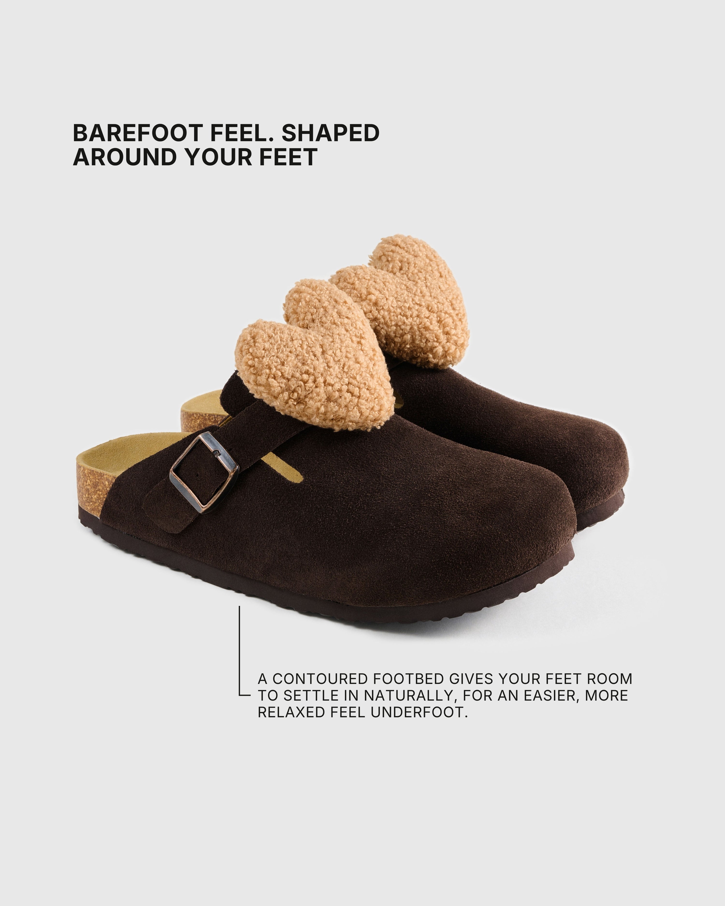 Shaped footbed inside the heart-detail brown suede clogs with an adjustable buckle strap