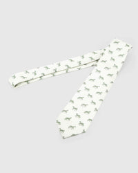 Ivory Equestrian Tie laid full length to show ivory ground with sage and forest horse silhouettes from blade to tail.