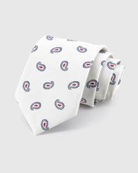 STICKYZOO Ivory Tricolor Paisley Tie rolled on white, showing an ivory ground with small navy-outline paisleys and crisp crimson centres across the front blade.