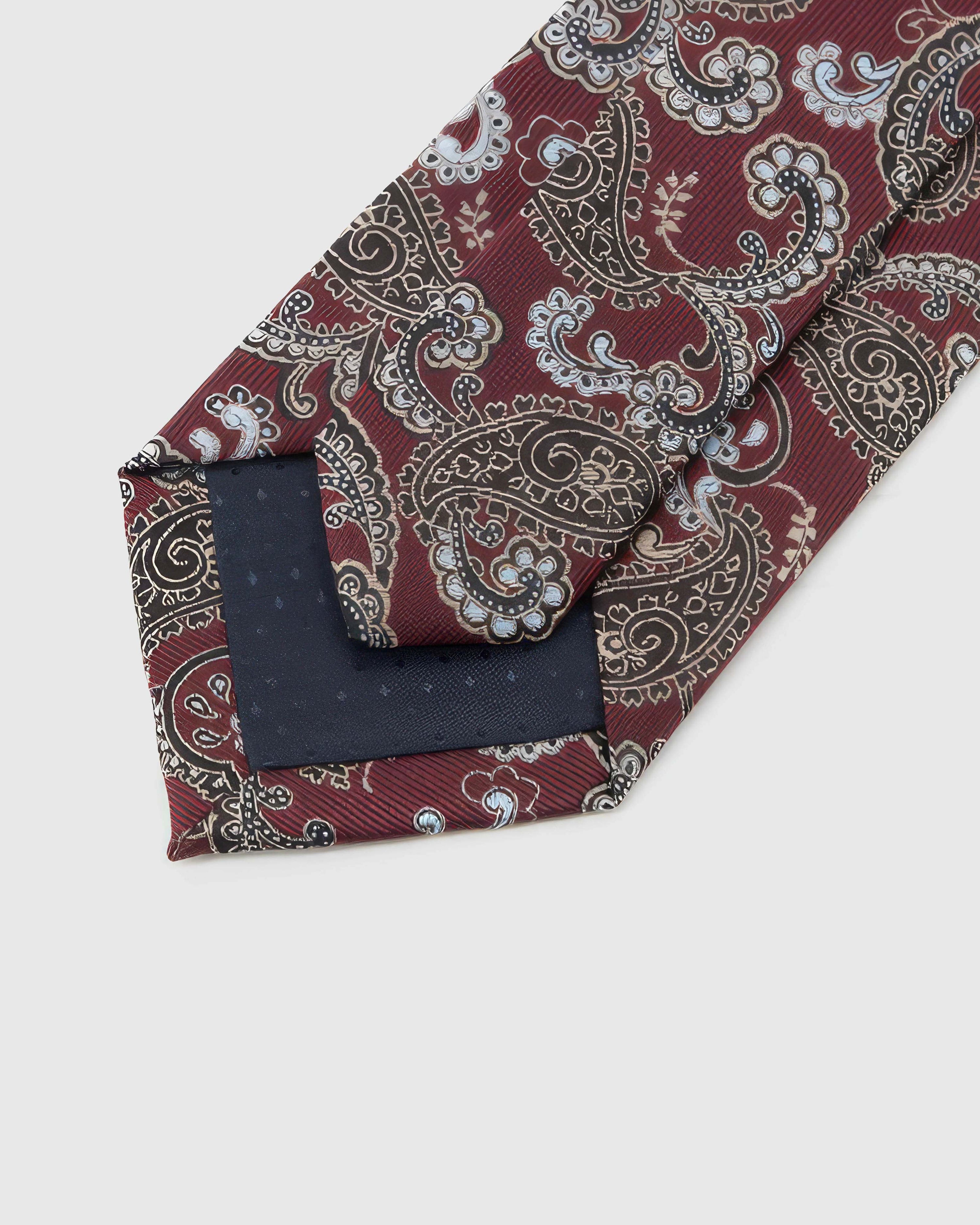 Back of STICKYZOO Claret Paisley Tie showing dark navy structured interlining, hand-finished folds and keeper, 145 × 8 cm