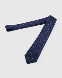Full-length STICKYZOO Midnight Quatrefoil Tie laid flat on white, showing the complete gold, amber and ivory quatrefoils repeat and 145 × 8 cm proportions