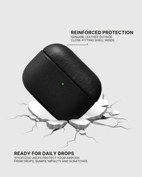 Black AirPods case landing on a cracked surface to illustrate drop protection