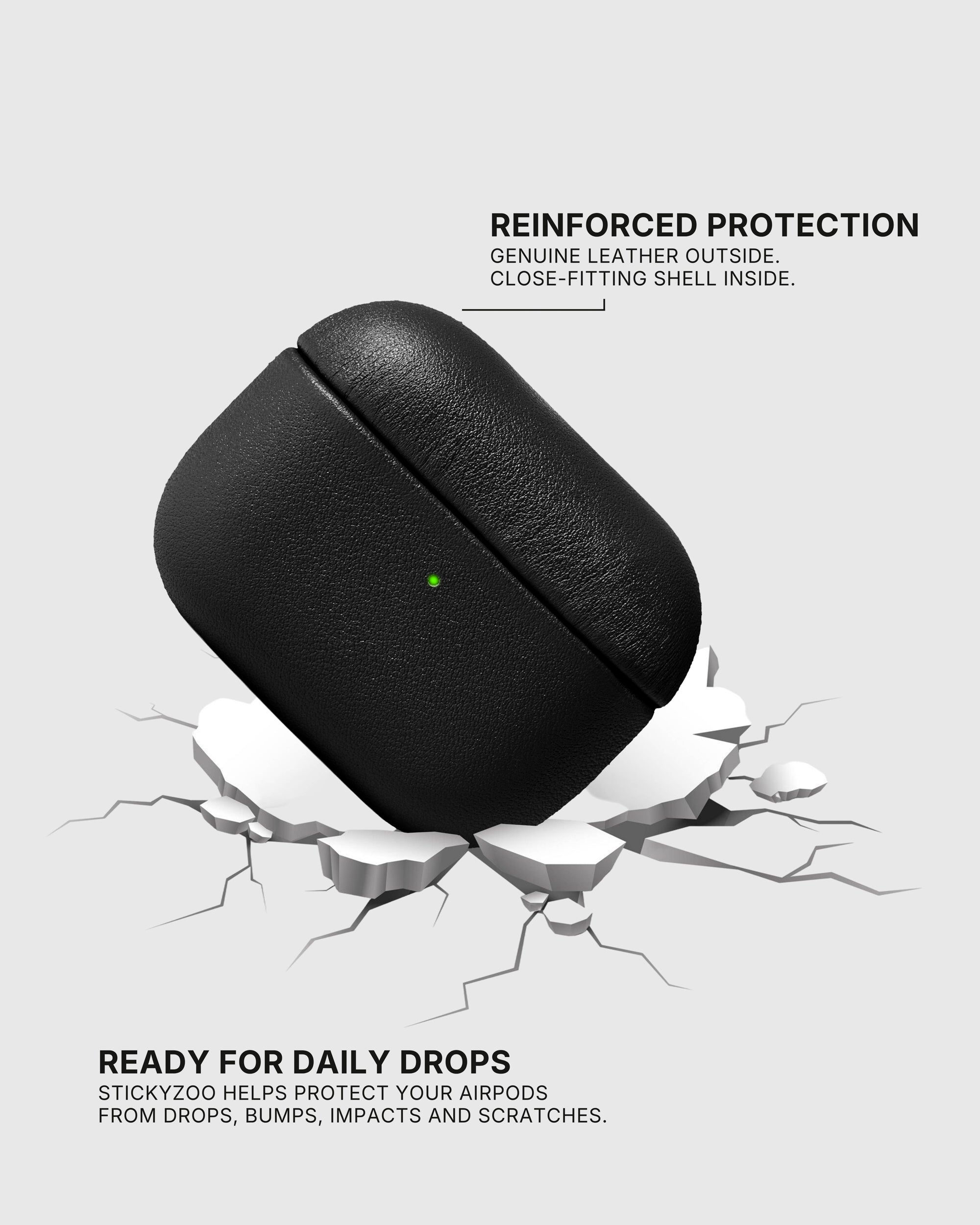 Black AirPods case landing on a cracked surface to illustrate drop protection