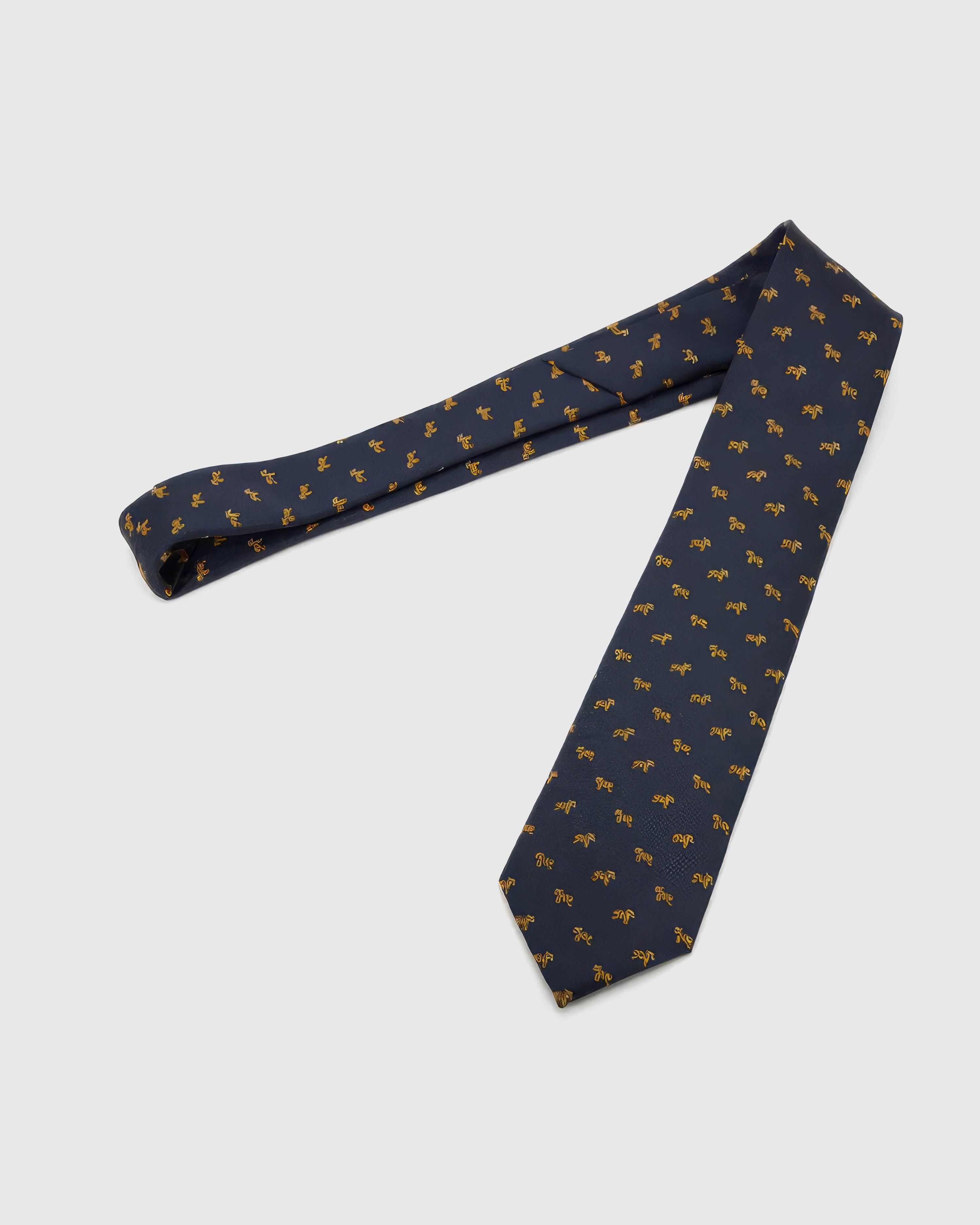 Midnight Golden Tiger Tie laid full length to show midnight ground with compact golden tiger motifs from blade to tail.