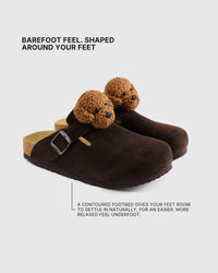 Shaped footbed inside the poodle brown suede clogs with an adjustable buckle strap