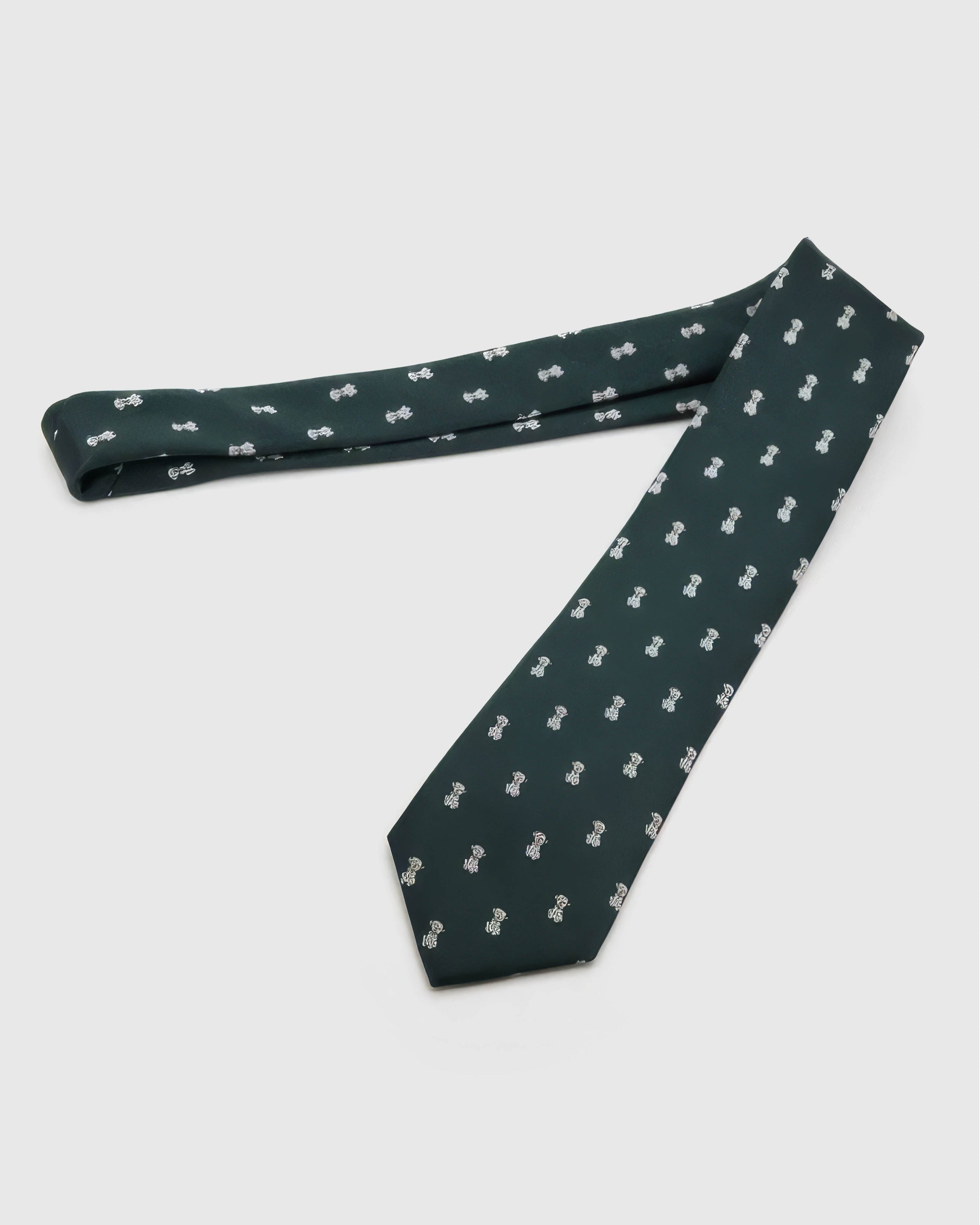 Forest Tiger Cub Tie laid full length to show forest ground with ivory tiger cubs and amber accents from blade to tail.