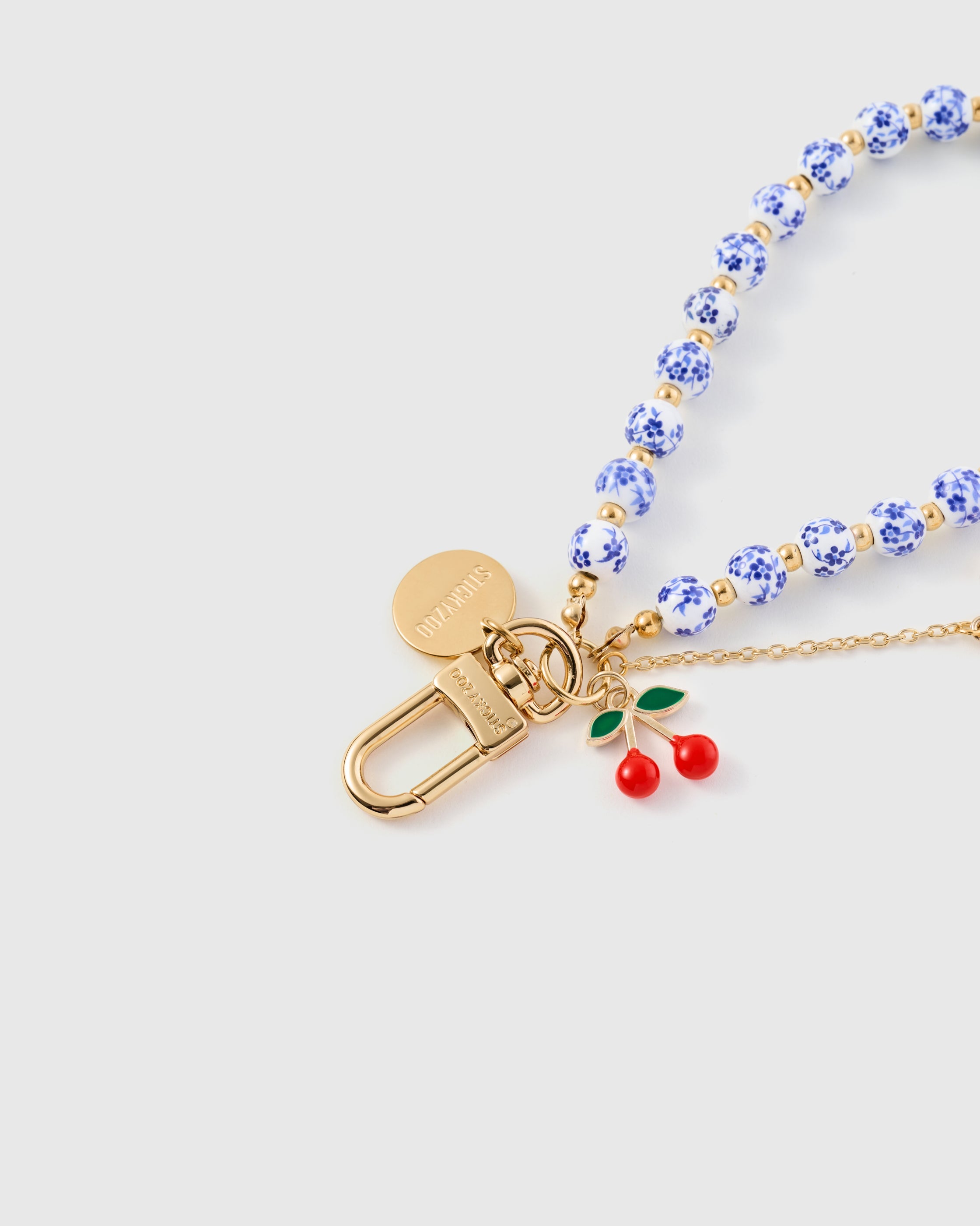 PORCELAIN CHERRY CHARM PHONE STRAP