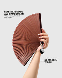 STICKYZOO chestnut hand fan held open to show its 32 cm width