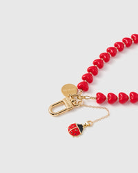 CRIMSON LADYBUG HEART STRAP NG TELEPONO  