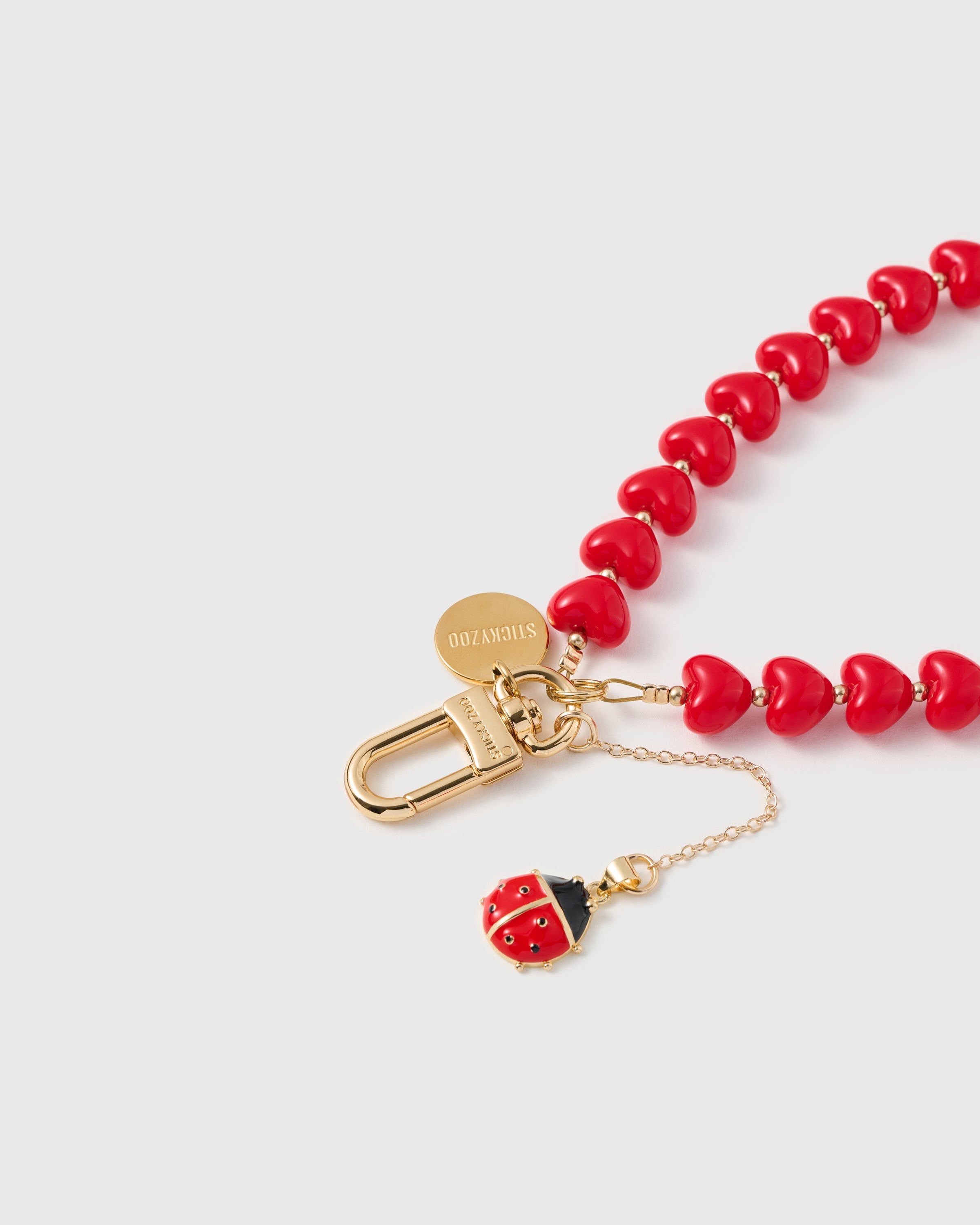 CRIMSON LADYBUG HEART STRAP NG TELEPONO  