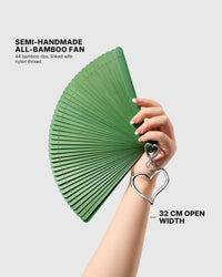 STICKYZOO jade hand fan held open to show its 32 cm width