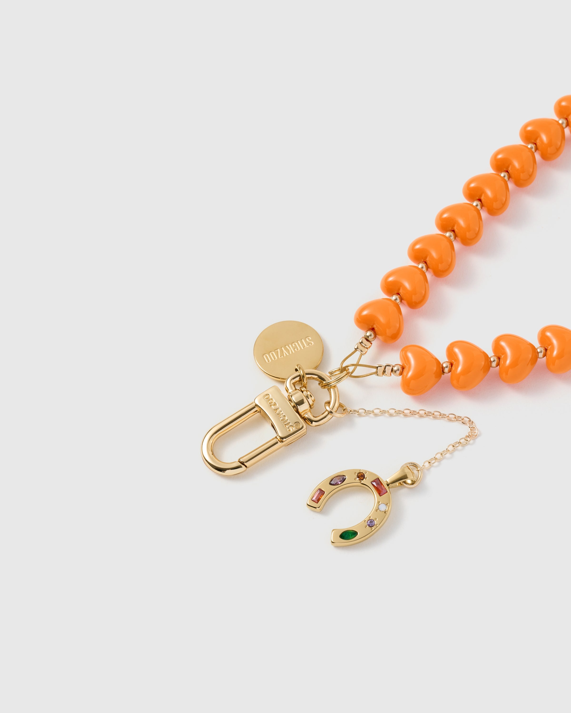 TANGERINE HORSESHOE HEART PHONE STRAP