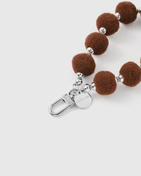 BROWN POM PHONE STRAP