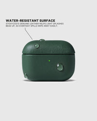 Water droplets beading on the Green AirPods case surface