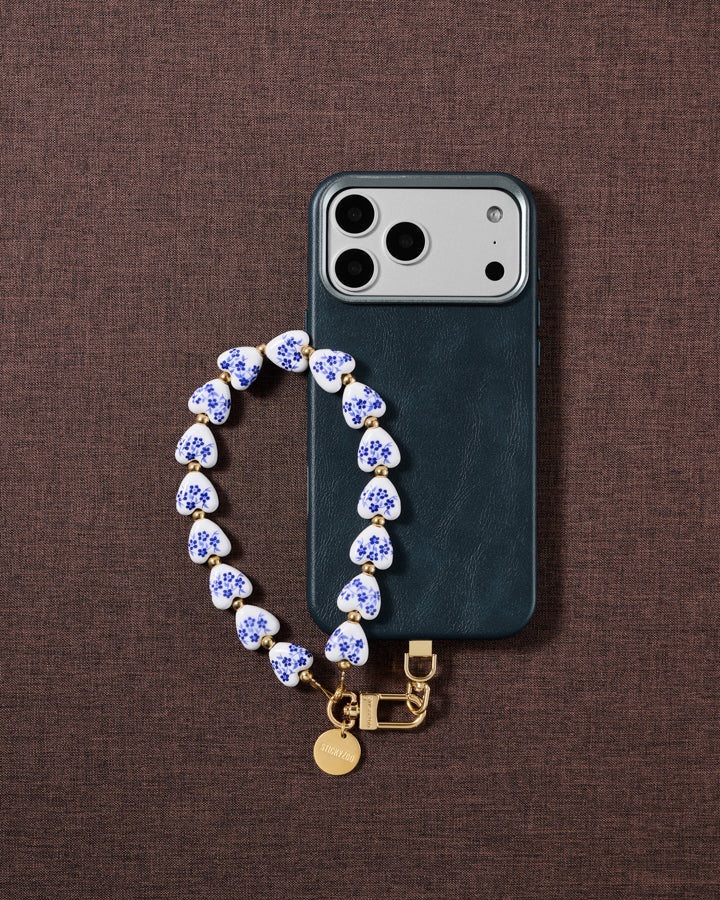 Porcelain heart phone strap styled on fabric, loved by thousands of STICKYZOO customers