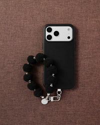 BLACK POM PHONE STRAP