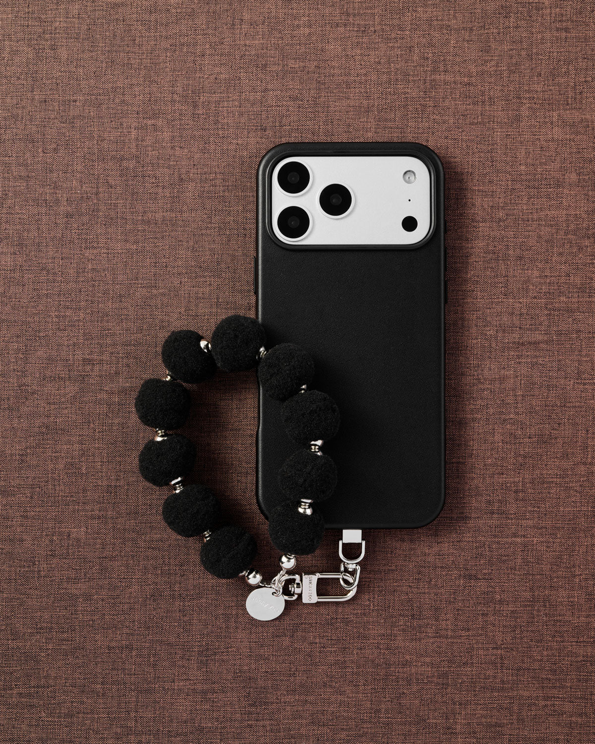 BLACK POM PHONE STRAP
