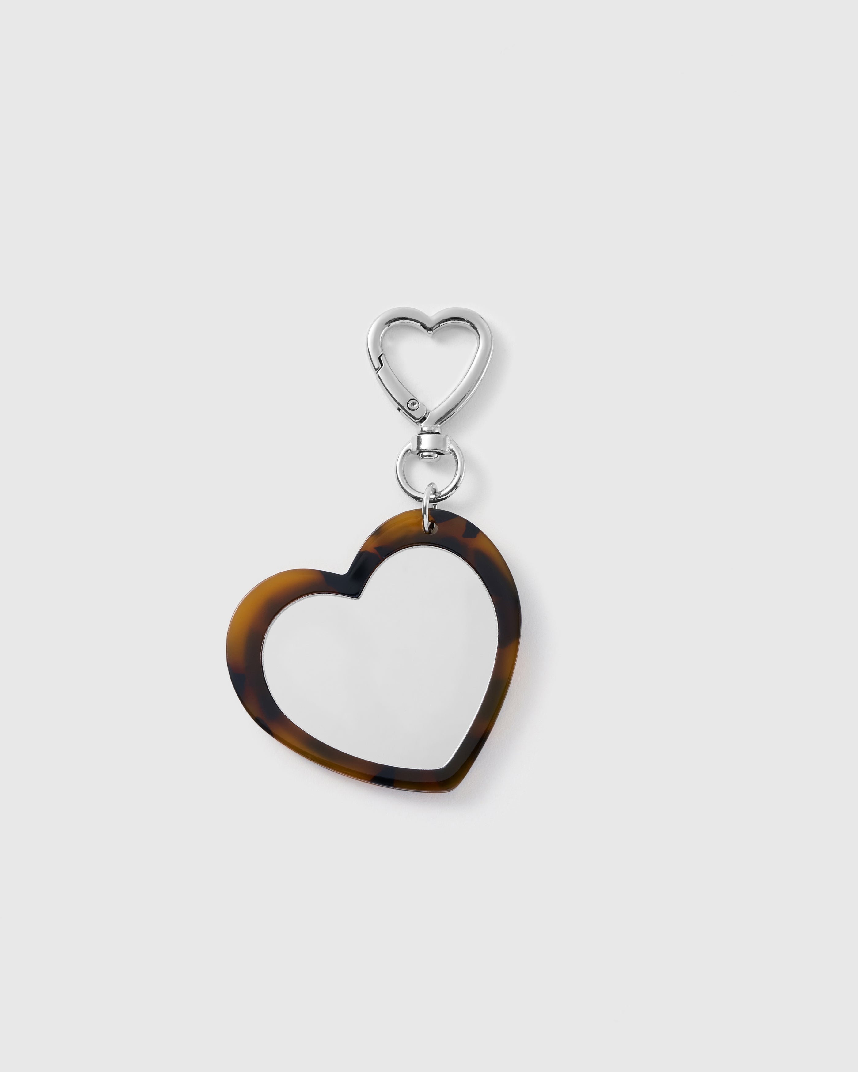 STICKYZOO Amour Heart Mirror Charm with a heart-shaped mirror, amber-and-black tortoiseshell-pattern frame and silver-tone heart clasp