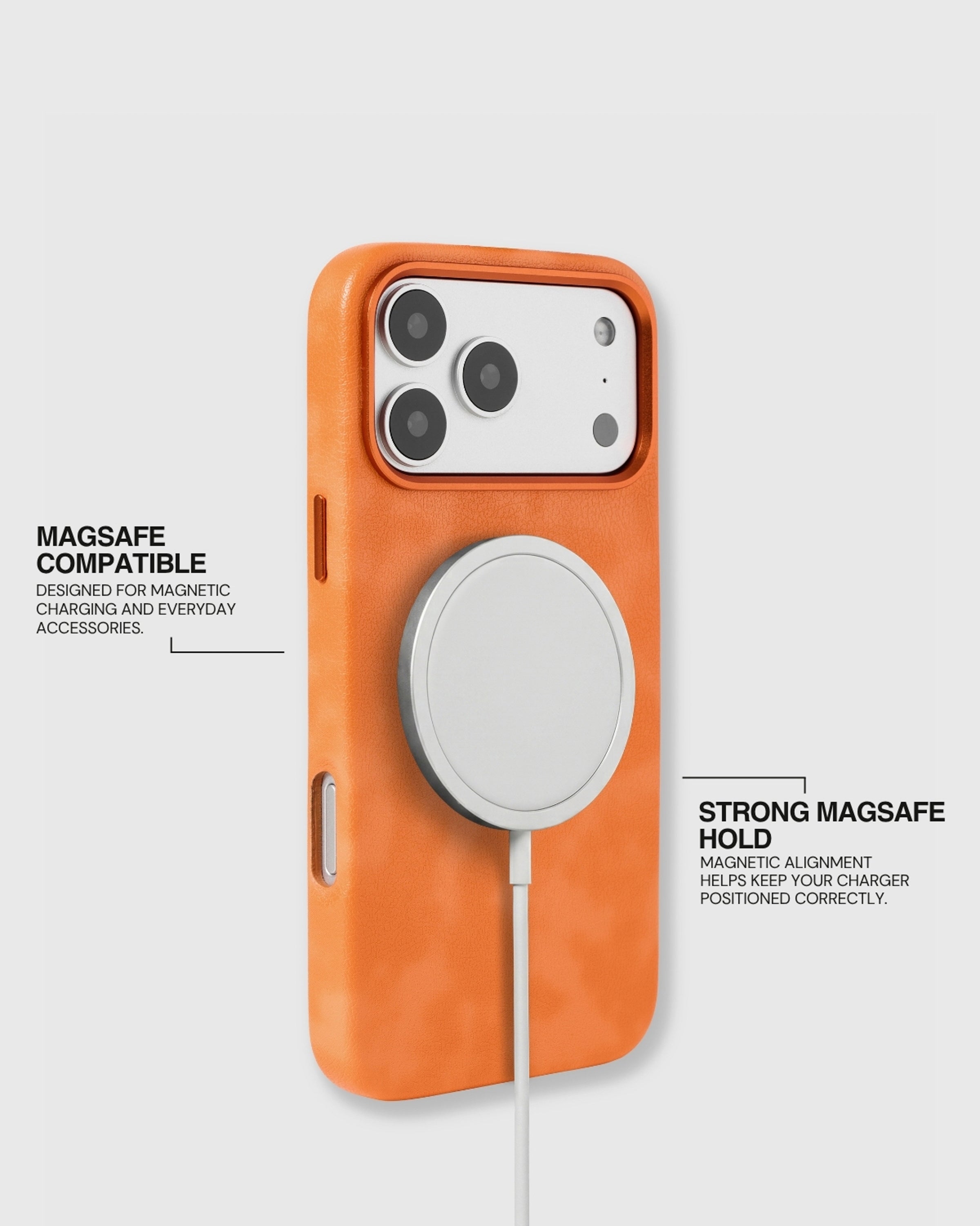 Orange STICKYZOO Heritage Leather Case aligned with a MagSafe charger