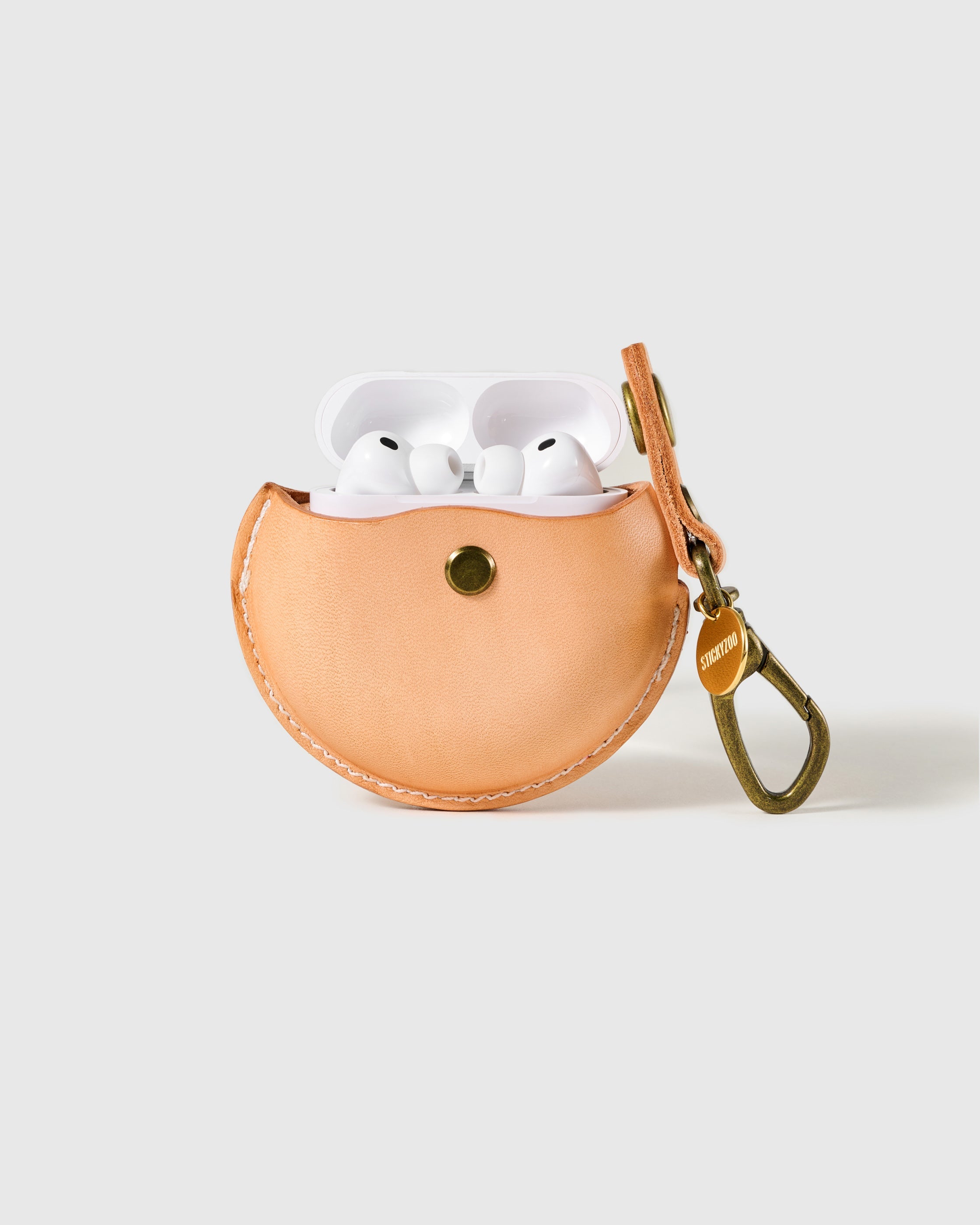 Natural STICKYZOO Wave Pocket AirPods Case open to show the snap-close front