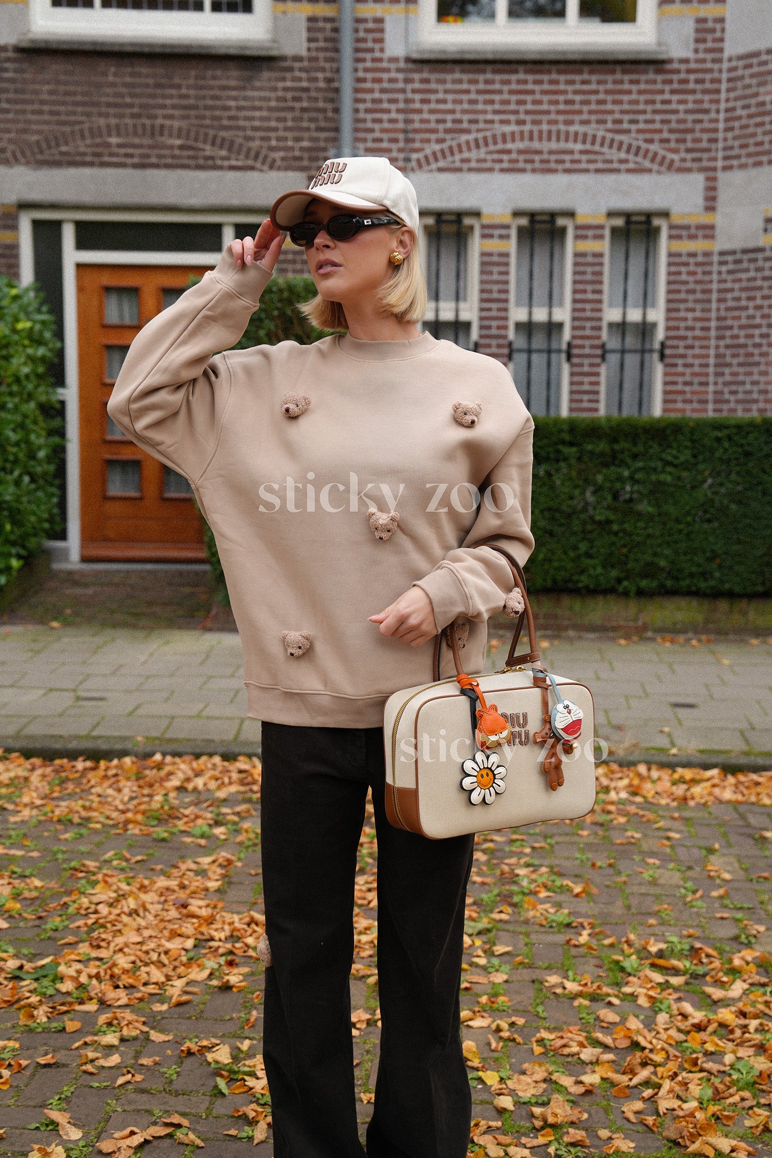 Full view of Sticky Bear Sweatshirt in brown on model showing oversized fit and bear detail