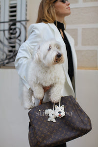 Handmade Poodle leather bag charm styled on a handbag — French Alran goatskin, 18K gold-plated hardware. STICKYZOO Amsterdam design.